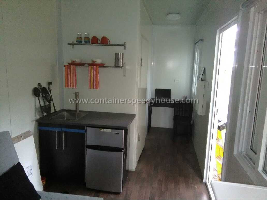 Container house with cladding panel