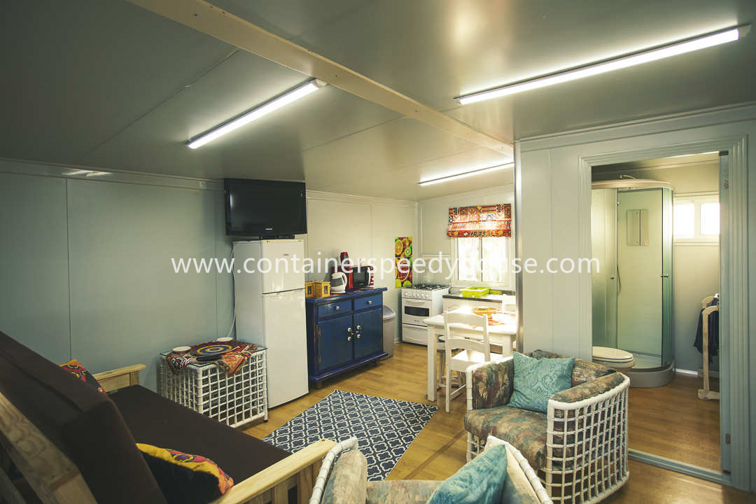 Expandable container house with balcony and furniture