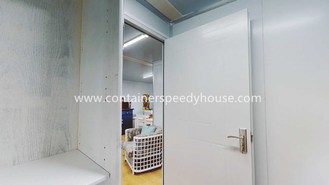 Expandable container house with balcony and furniture